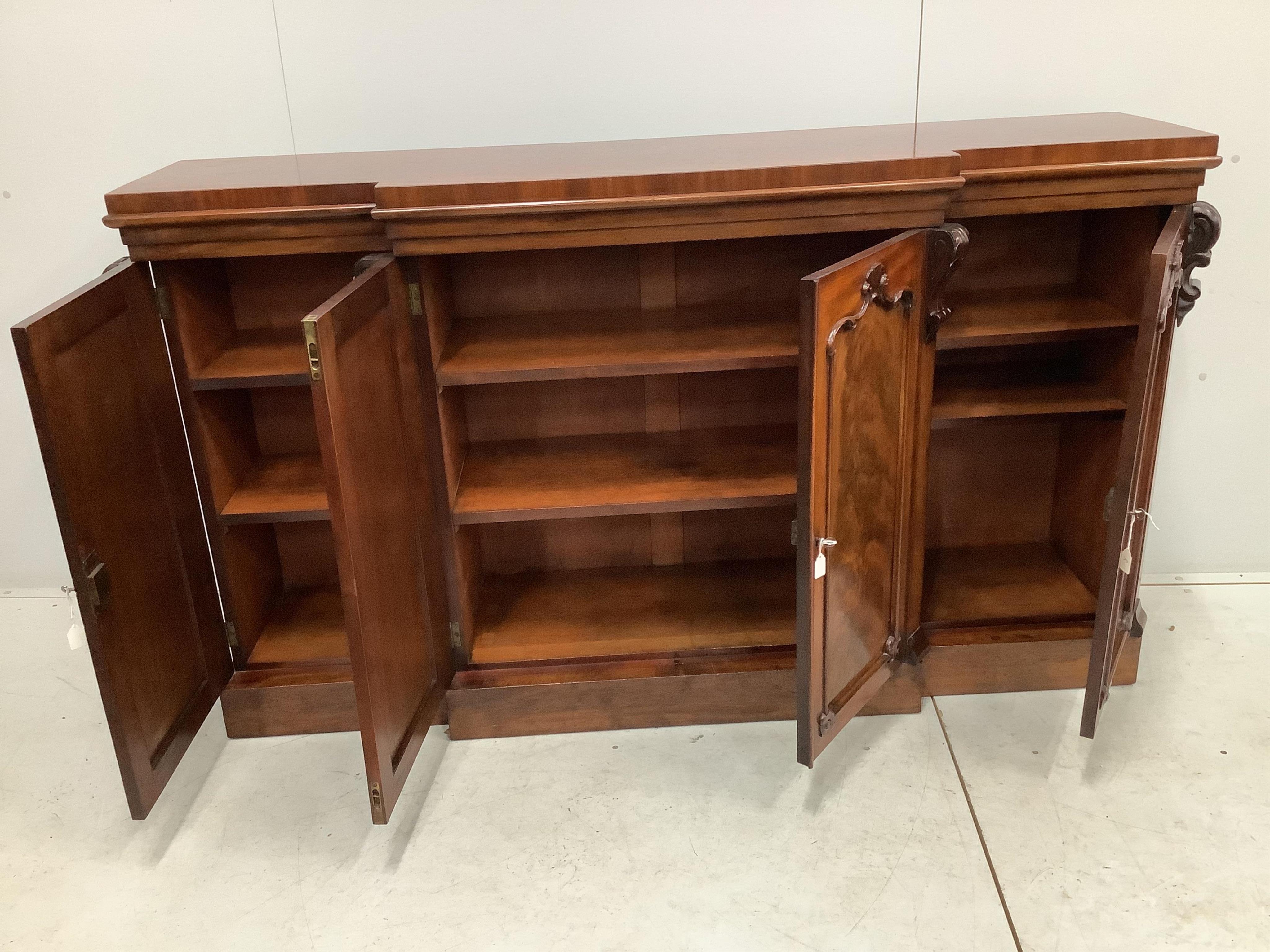 A mahogany breakfront dwarf bookcase, width 170cm, height 99cm. Condition - fair to good